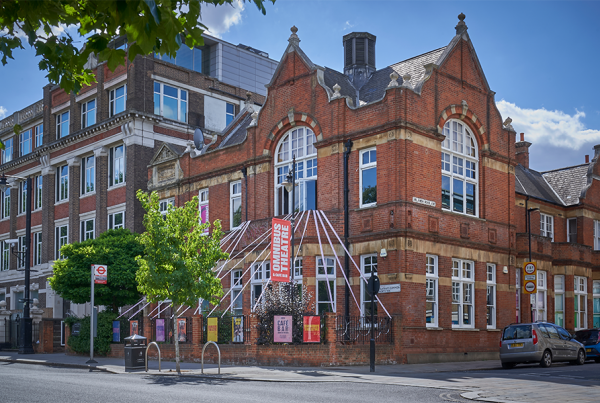 A photograph of a red brick theatre building. Clapham Space Hire