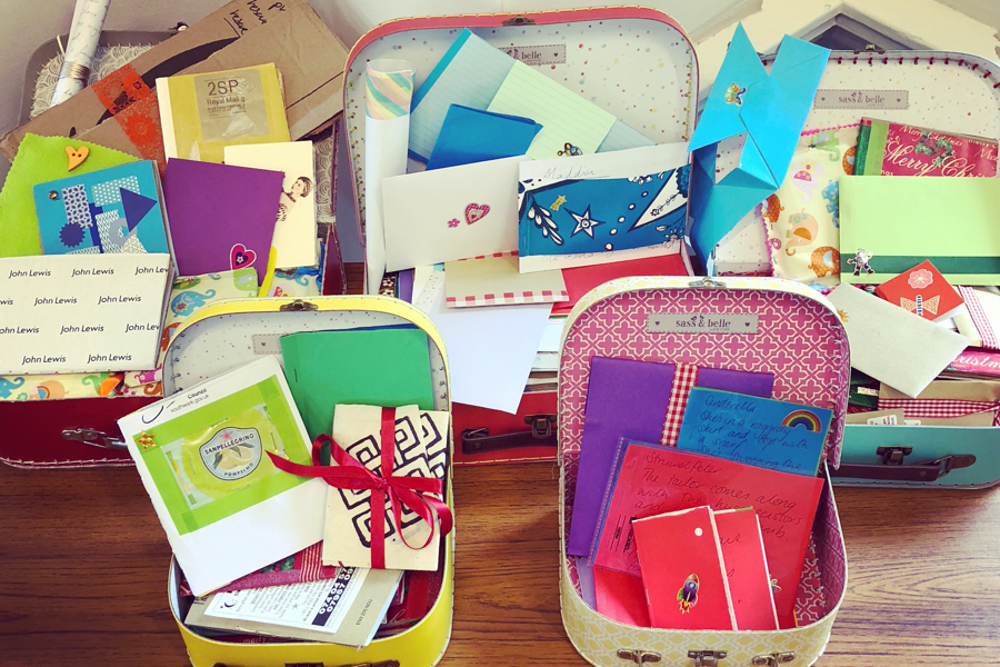 An image of assorted colourful boxes containing letters and various mementos