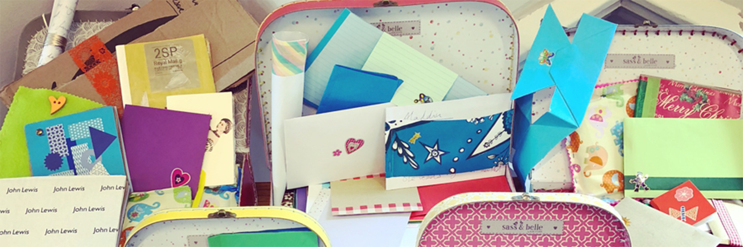 An image of assorted colourful boxes containing letters and various mementos