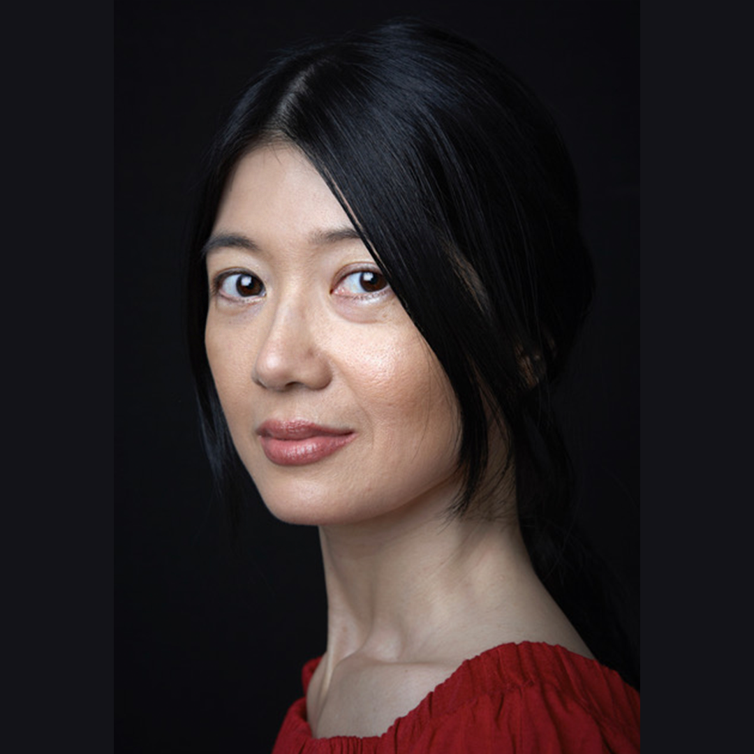 Headshot of Jennifer Lim an asian woman with short straight black hair wearing a red top