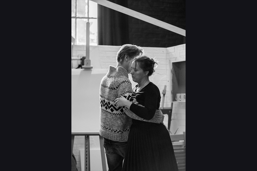 Two actors rehearsing, slow dancing together